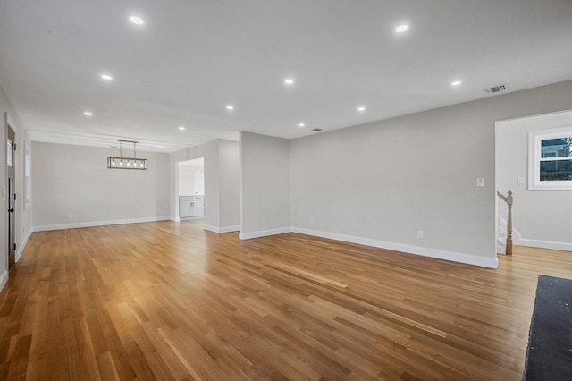 unfurnished living room featuring light hardwood / wood-style flooring