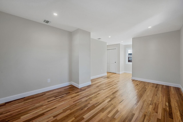 spare room featuring light hardwood / wood-style floors