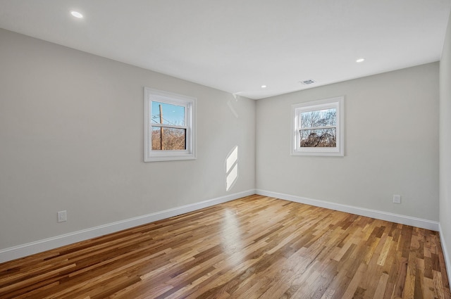 spare room with light hardwood / wood-style floors