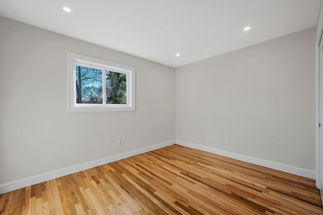 spare room featuring light hardwood / wood-style flooring