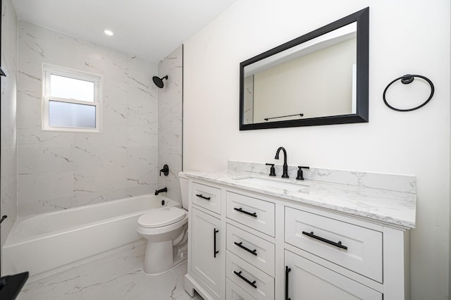 full bathroom featuring vanity, tiled shower / bath combo, and toilet