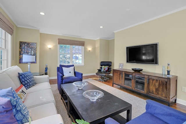 living area featuring ornamental molding, recessed lighting, wood finished floors, and baseboards