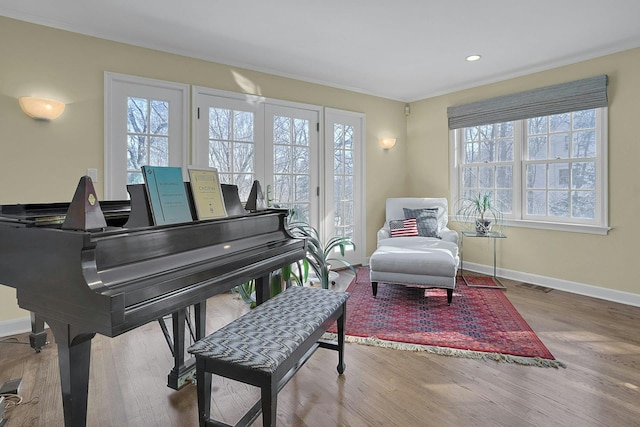 sitting room with visible vents, baseboards, wood finished floors, and recessed lighting