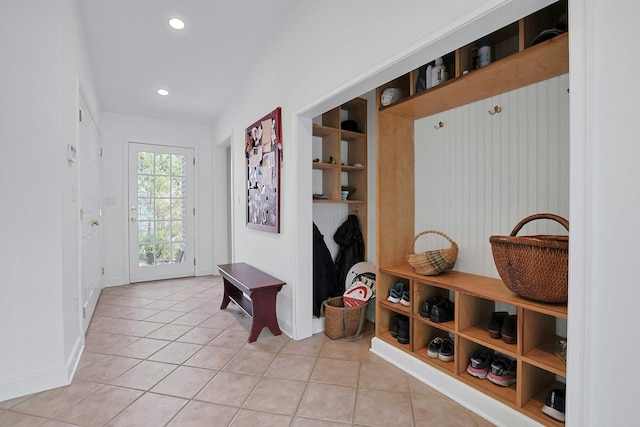 mudroom featuring light tile patterned floors, recessed lighting, baseboards, and built in features