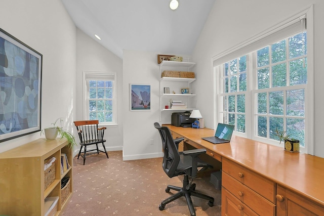 office with vaulted ceiling, baseboards, and light colored carpet