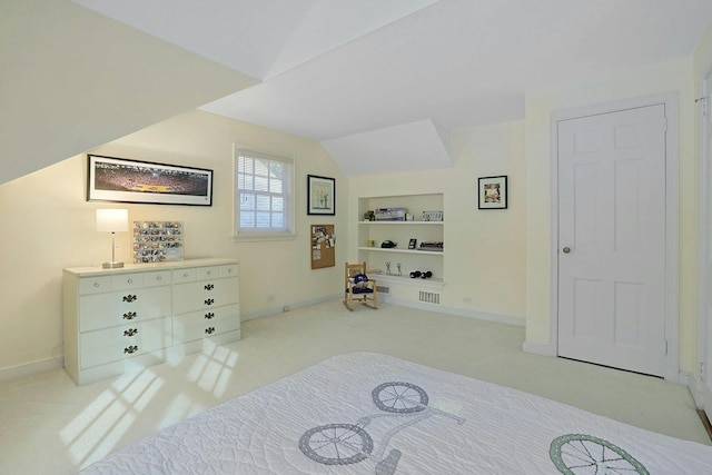 bedroom with carpet flooring, vaulted ceiling, and baseboards