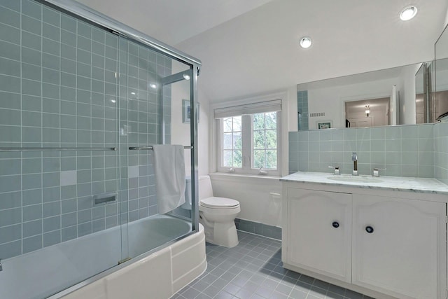 full bathroom featuring toilet, enclosed tub / shower combo, tile patterned flooring, vanity, and backsplash