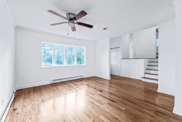 unfurnished living room featuring wood-type flooring, a baseboard heating unit, crown molding, and ceiling fan