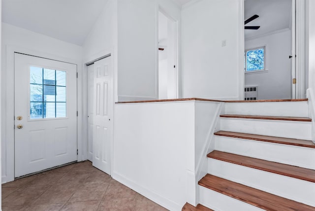 interior space featuring tile patterned flooring, plenty of natural light, and lofted ceiling