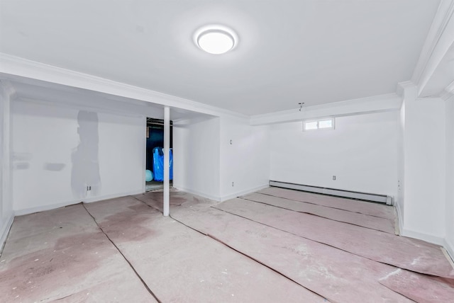 basement featuring ornamental molding and baseboard heating