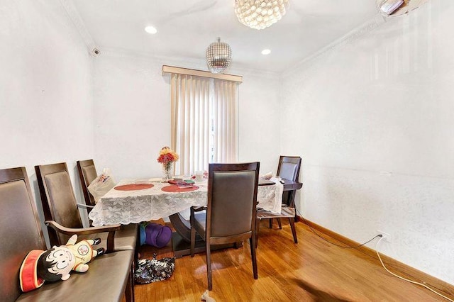 dining area featuring crown molding and wood-type flooring