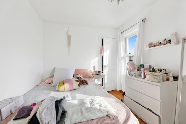 bedroom with light wood-type flooring