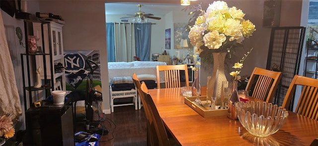 dining room with hardwood / wood-style flooring and ceiling fan