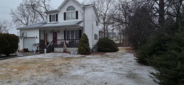 view of front of house featuring a garage and a porch