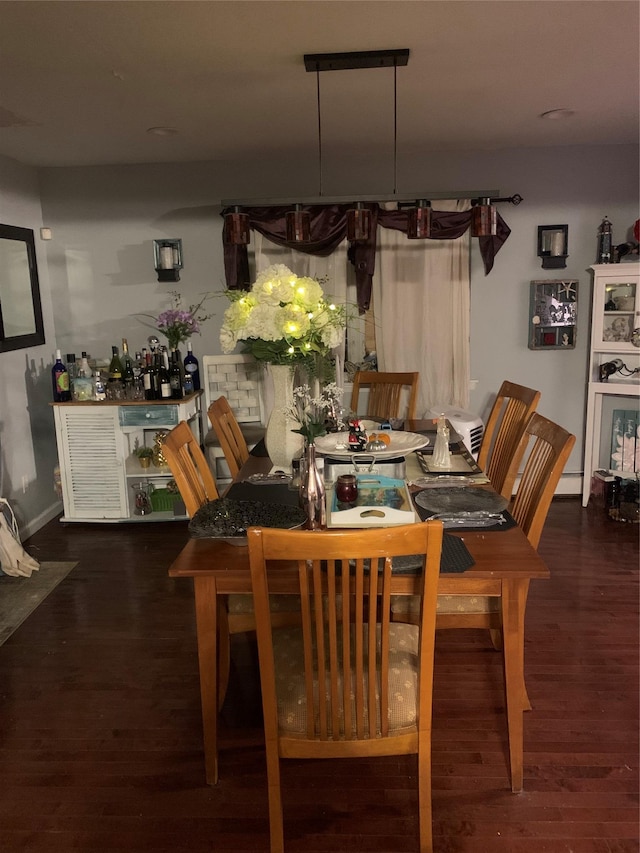 dining area featuring dark hardwood / wood-style floors