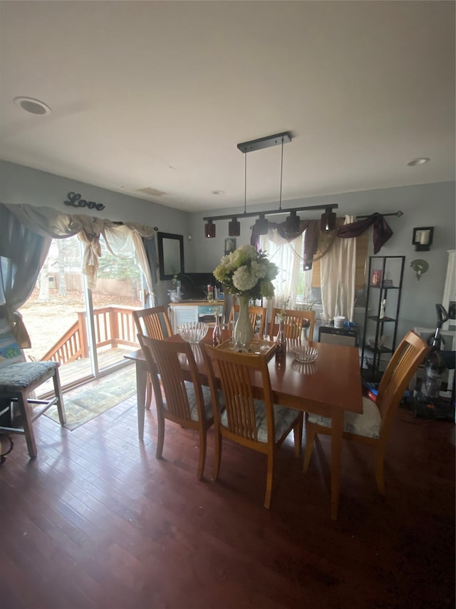 dining area with hardwood / wood-style flooring