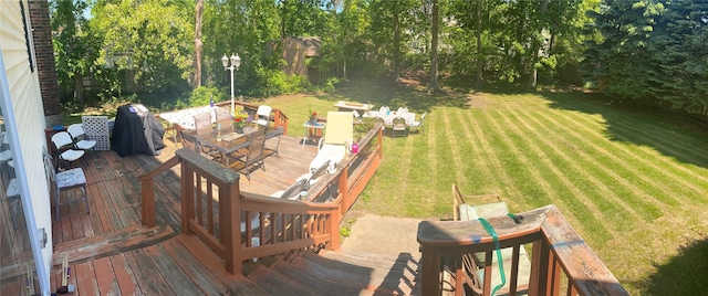 view of yard with a wooden deck