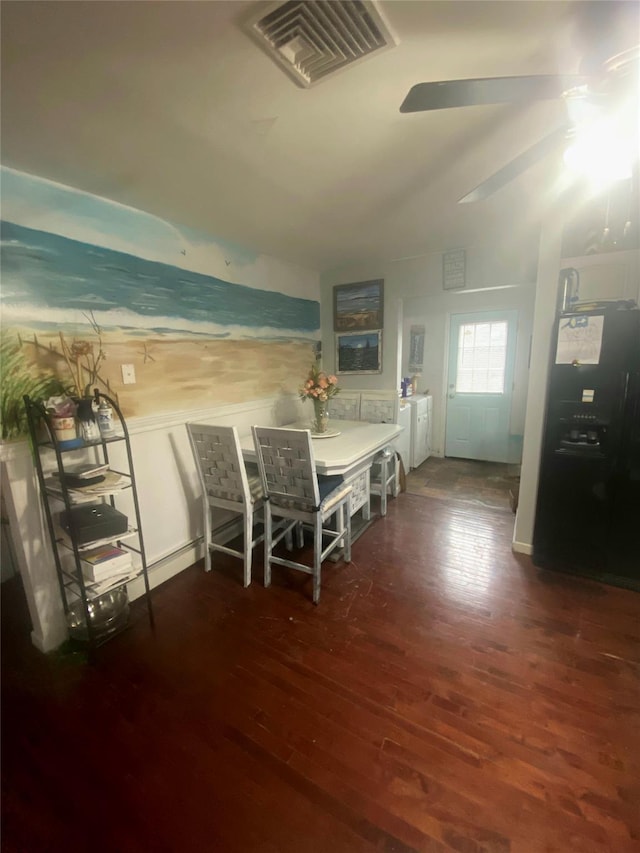 unfurnished dining area featuring dark wood-type flooring