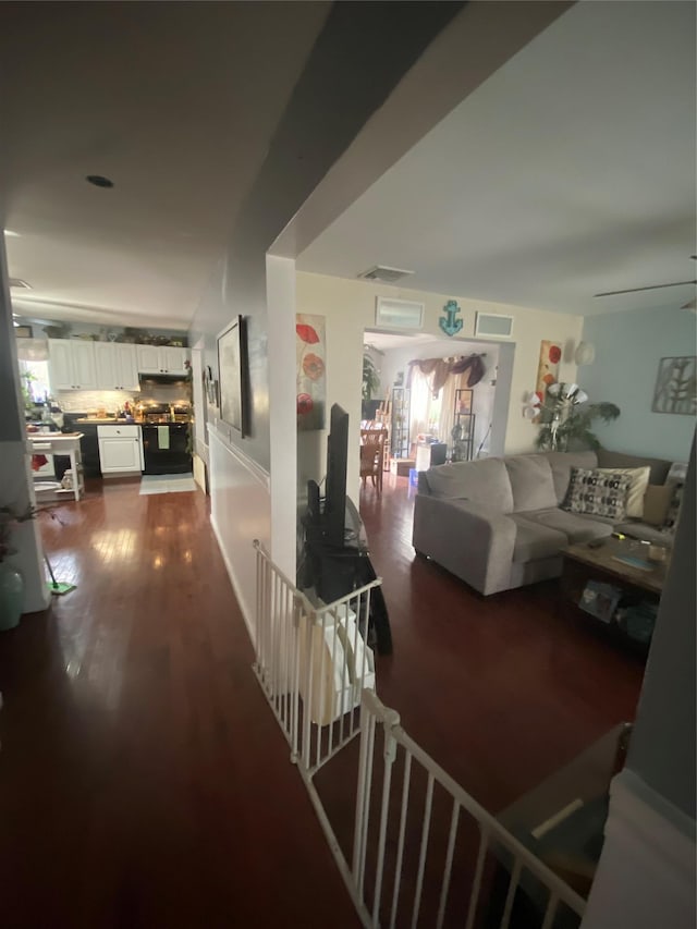 hall with dark hardwood / wood-style floors