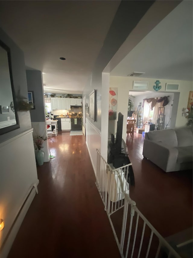 hallway with dark wood-type flooring