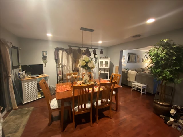 dining space with dark hardwood / wood-style floors