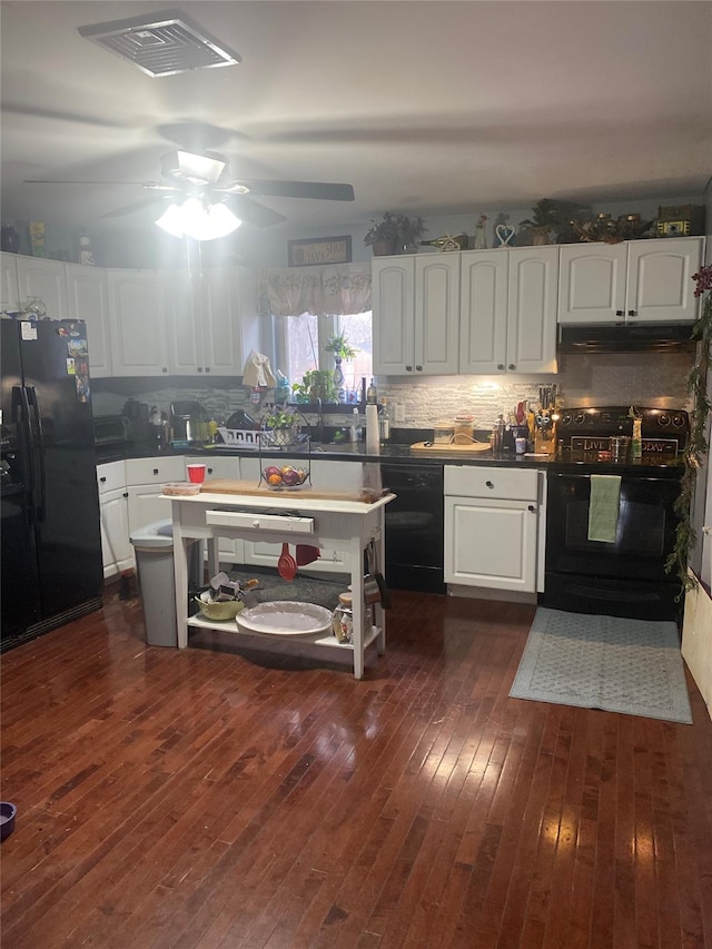 kitchen featuring white cabinets, decorative backsplash, ceiling fan, black appliances, and dark wood-type flooring