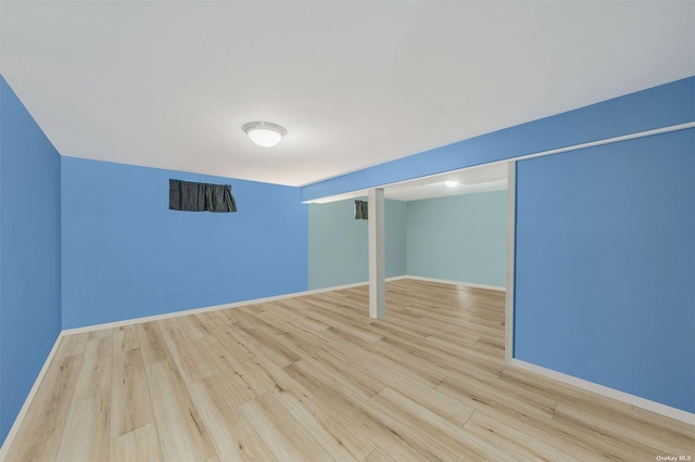 basement featuring light wood-type flooring