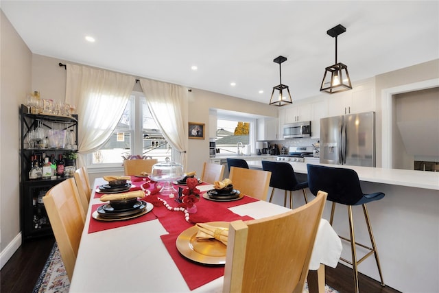 dining area with dark wood-type flooring