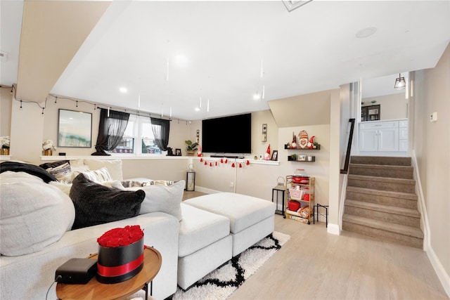 living room with light hardwood / wood-style flooring