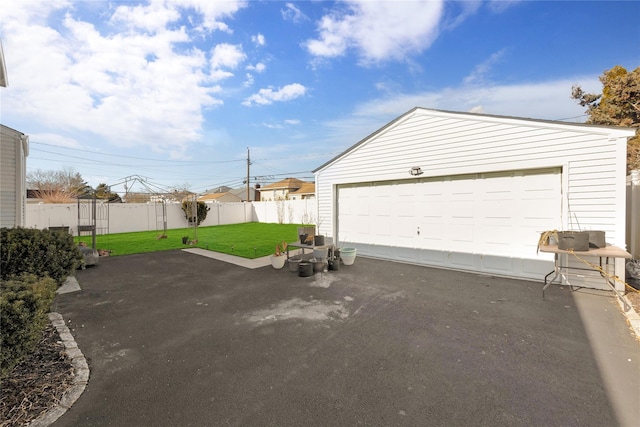 garage with a yard