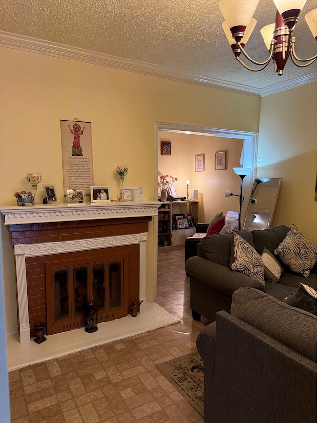 living area featuring crown molding, an inviting chandelier, and a glass covered fireplace