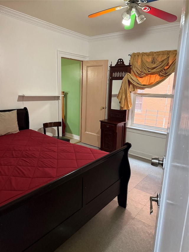 bedroom featuring baseboards, ornamental molding, and a ceiling fan
