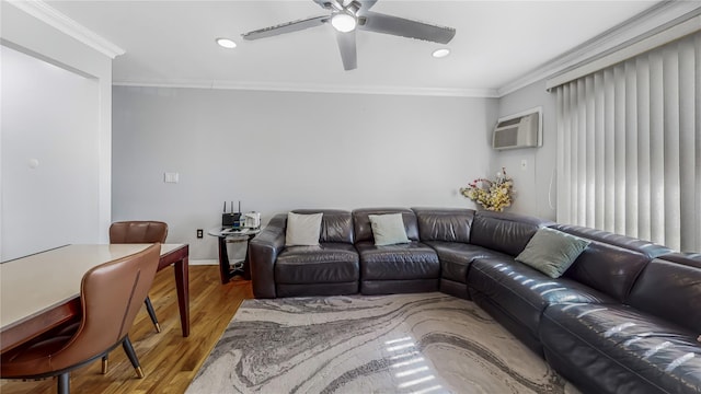 living room featuring crown molding, ceiling fan, hardwood / wood-style floors, and a wall unit AC