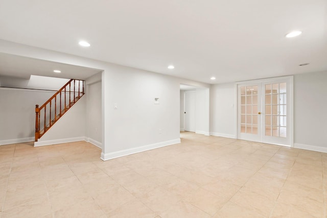 spare room featuring french doors