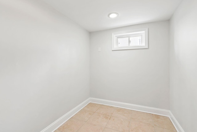 spare room featuring light tile patterned flooring