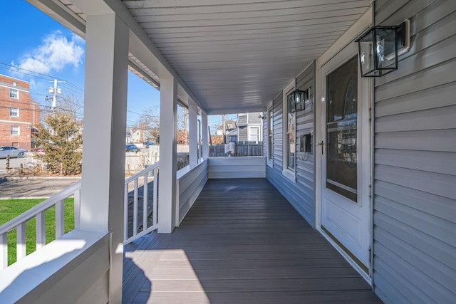 wooden terrace featuring covered porch