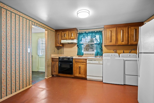 kitchen with white appliances, washer and clothes dryer, and sink