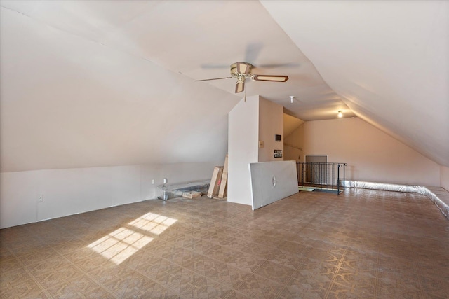 additional living space featuring vaulted ceiling and ceiling fan