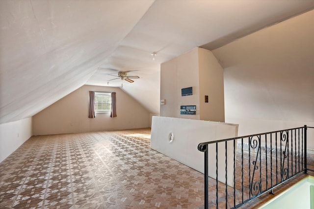 bonus room featuring lofted ceiling and ceiling fan