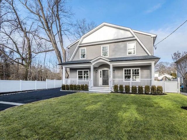 front facade with a porch and a front lawn