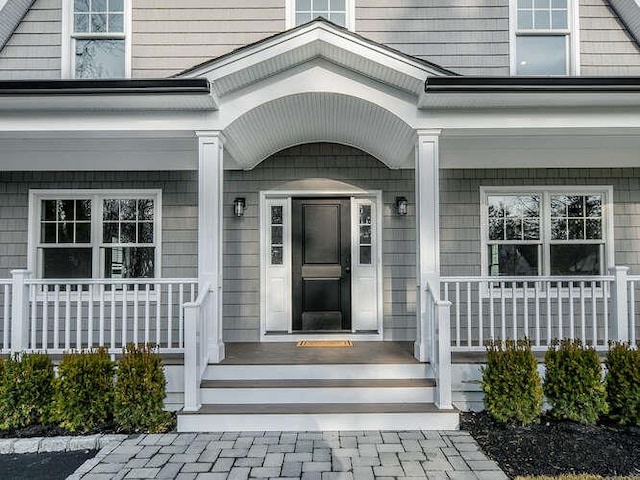 doorway to property with covered porch