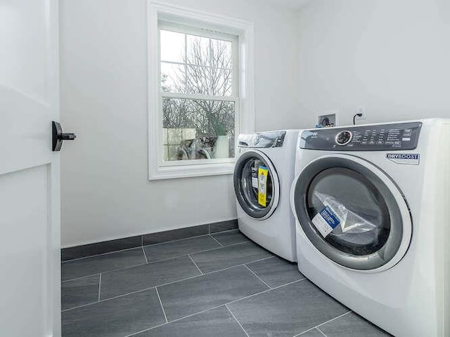 laundry room with washing machine and clothes dryer