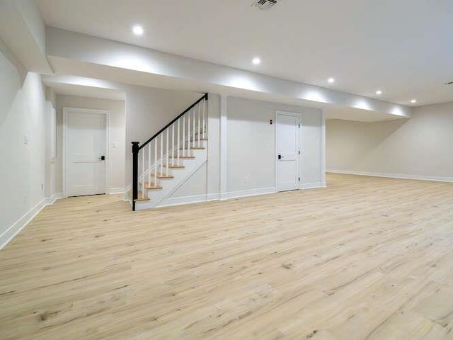 basement featuring light hardwood / wood-style flooring