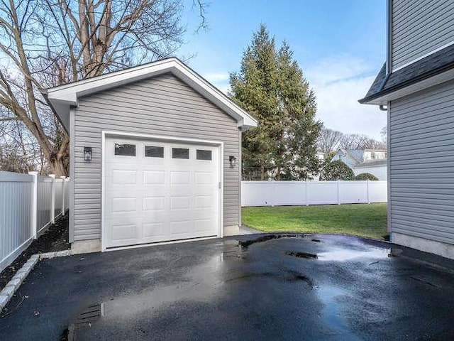 garage featuring a yard