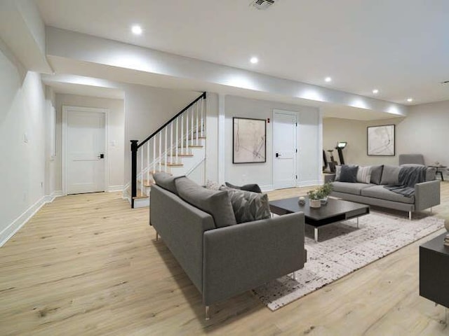 111 Fairfield Ave, Port Washington, NY 11050 - living area featuring recessed lighting, stairway, baseboards, and light wood-style flooring