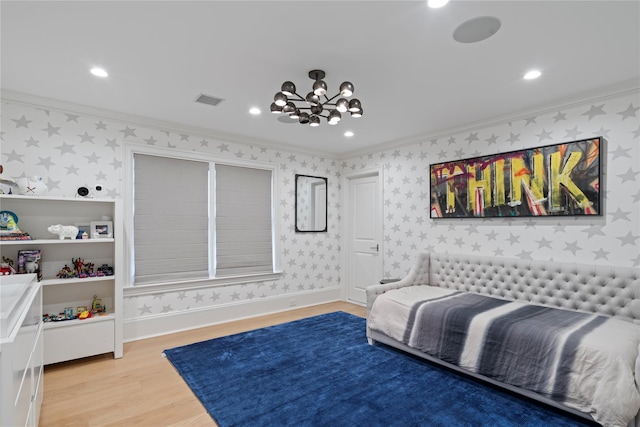 bedroom featuring crown molding, light wood-style floors, visible vents, and wallpapered walls