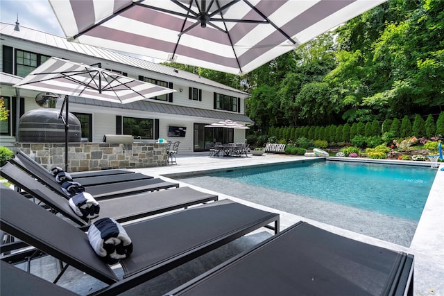 outdoor pool featuring a patio area