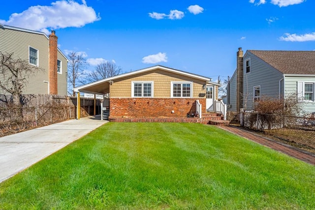 back of property featuring a yard and a carport