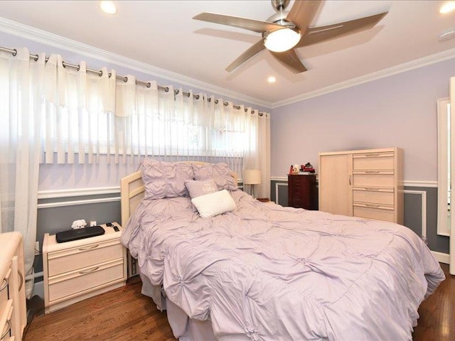 bedroom with crown molding, ceiling fan, and dark wood-type flooring