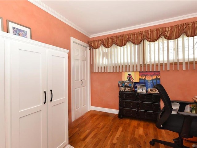 office area with hardwood / wood-style flooring and ornamental molding